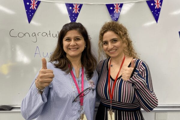 Two women with the thumbs up.