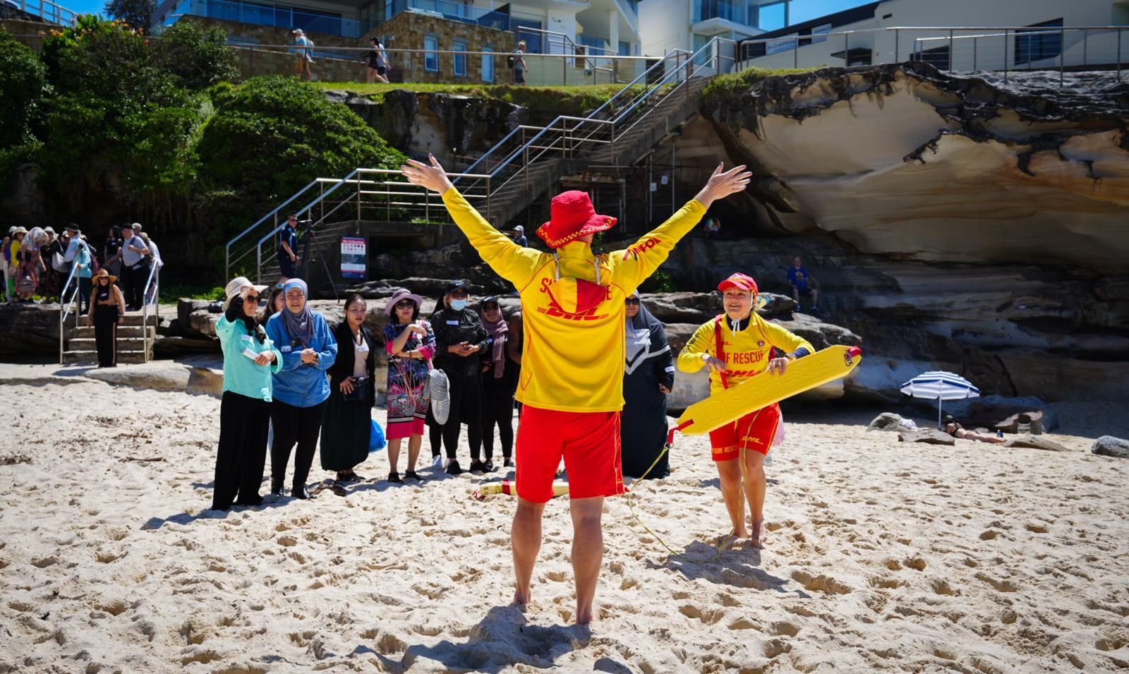 life savers in foreground teaching group in background