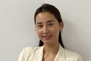 Hong in white jacket looking at the camera