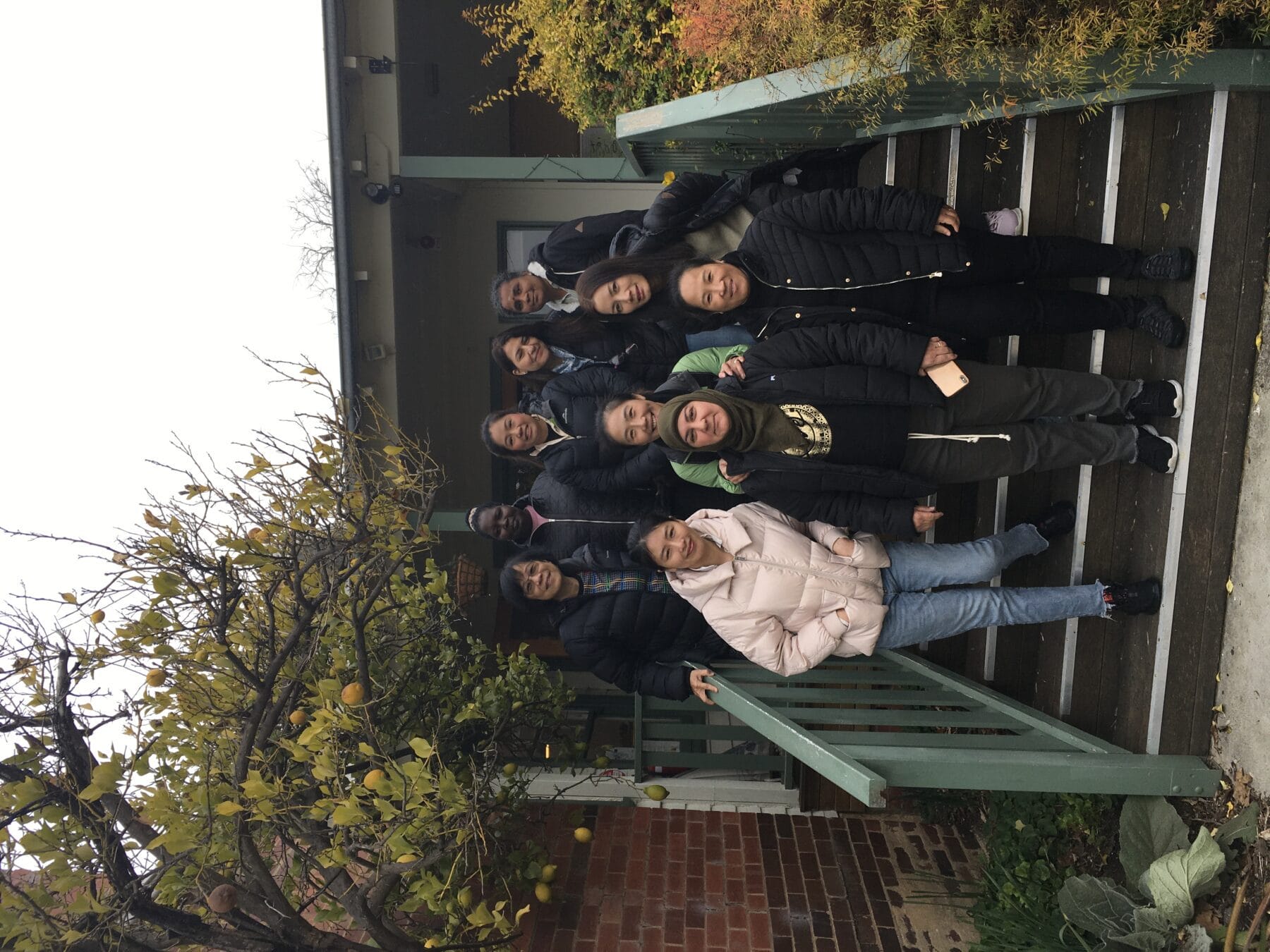 Group of people from diverse backgrounds standing together and smiling