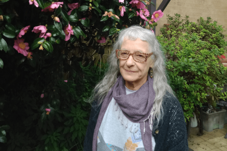 Older female with grey hair and glasses