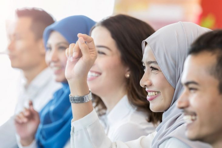 Adult learners. Women wearing hijab in class