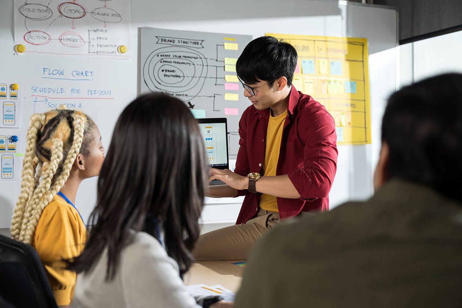 Lecturer helping students in classroom